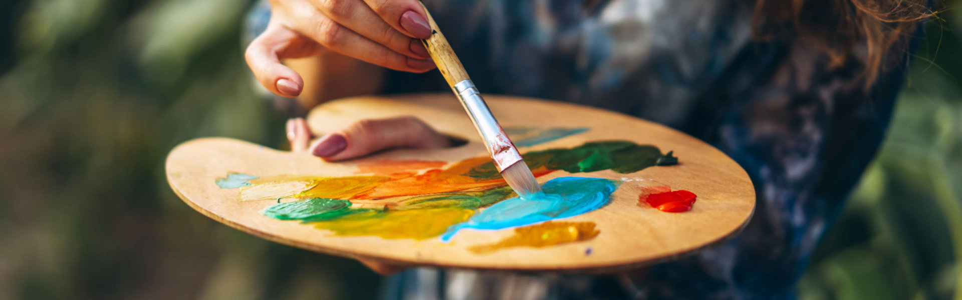 woman mixing painting colors