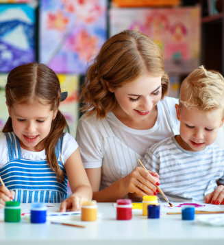 woman teaching her students to paint