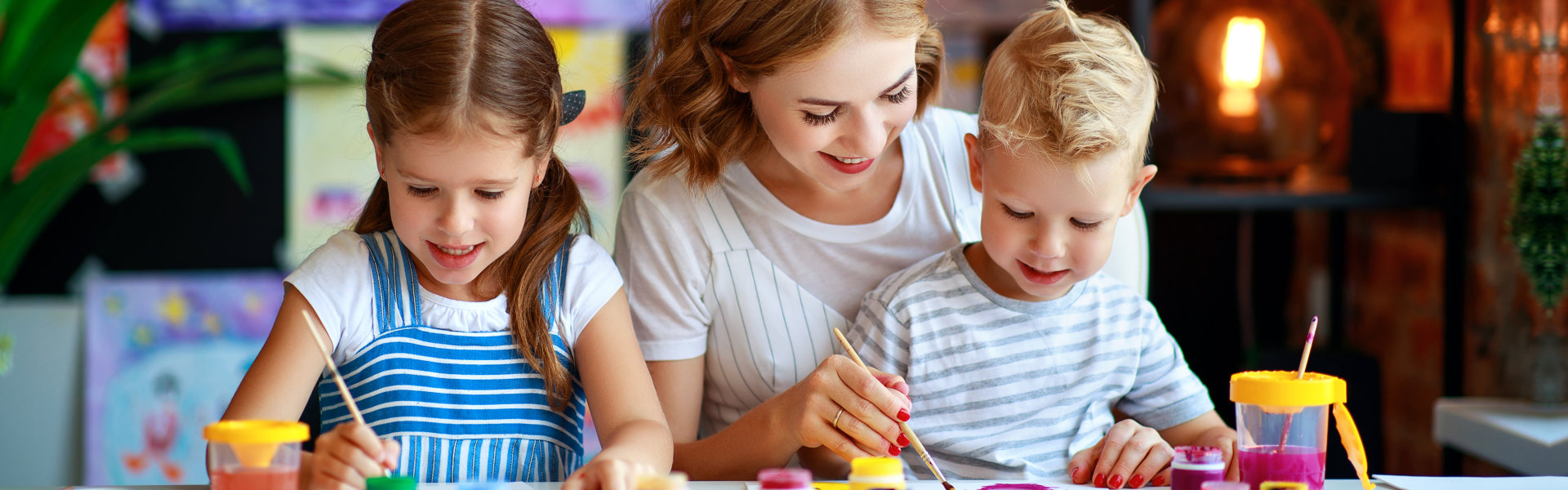 woman teaching her students to paint