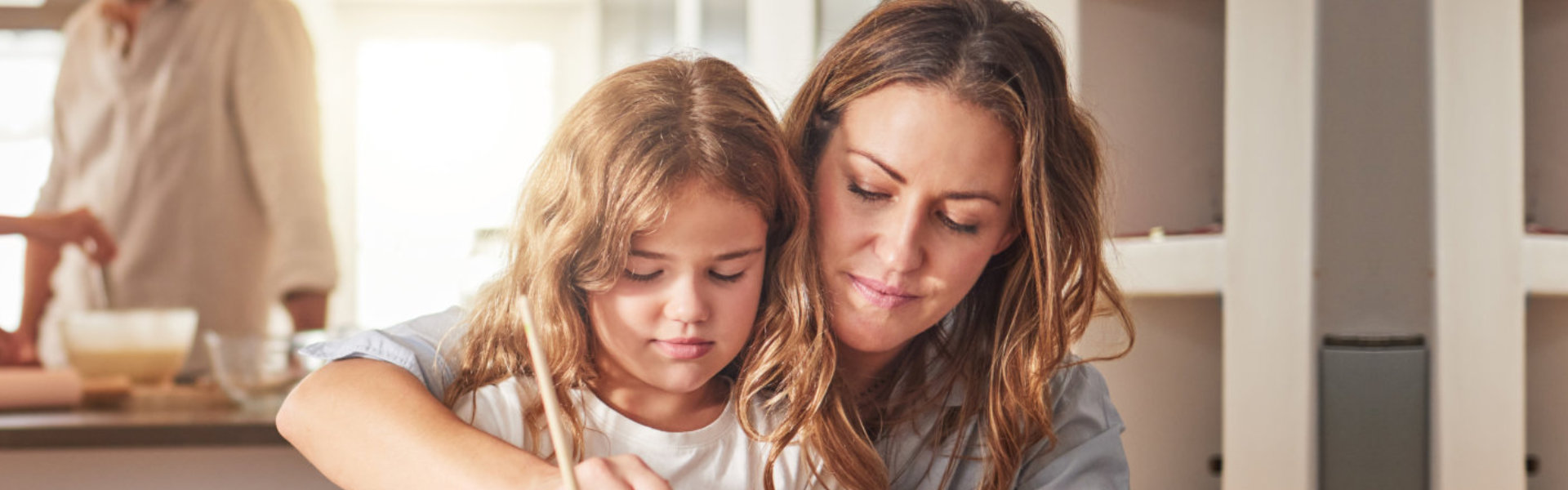 woman teaching her daughter to paint